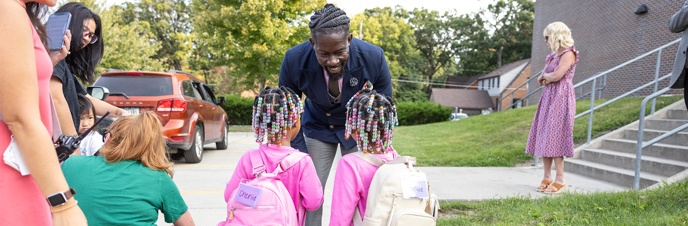 Superintendent greeting students